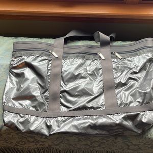 Zippered tote. Shiny, Vinyl coated silver nylon